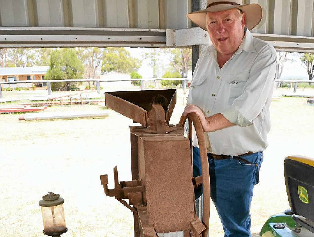 AGENT OF CHANGE: Auctioneer with Stuart Bond with an ageing corn shelling machine. This machine along with others will be up for auction at 249 Canningvale Rd from 10am Saturday. AGENT OF CHANGE: Auctioneer with Stuart Bond with an ageing corn shelling machine. This machine along with others will be up for auction at 249 Canningvale Rd from 10am Saturday.